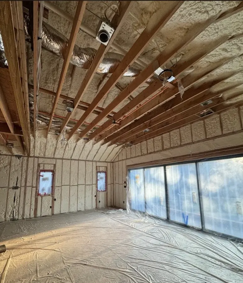 Interior walls and ceiling insulated with spray foam during new construction in Lyndon